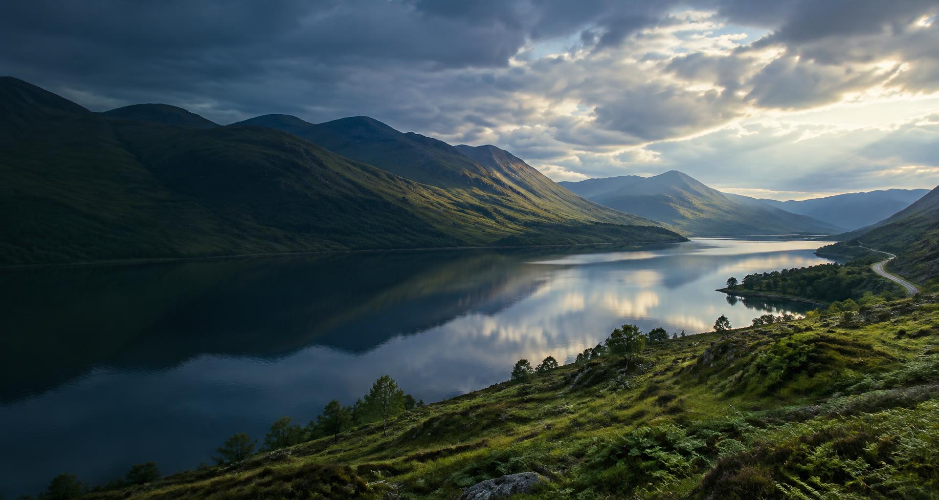 A peaceful loch surrounded by the Scottish Highlands